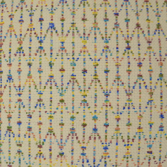 Cream woven fabric with tiny multicolor geometric motifs in vertical rows; lightweight textile for sewing or crafts.