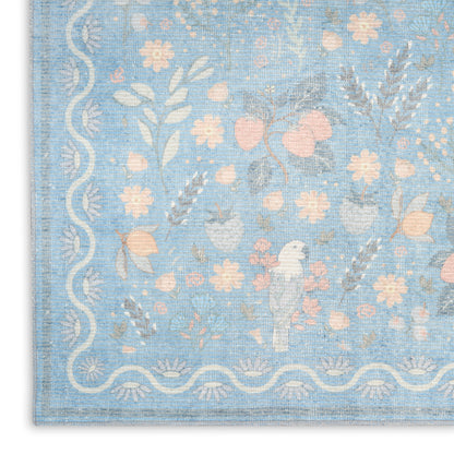 Pastel blue woven rug featuring pink and cream florals and a white scalloped border with a small bird motif.