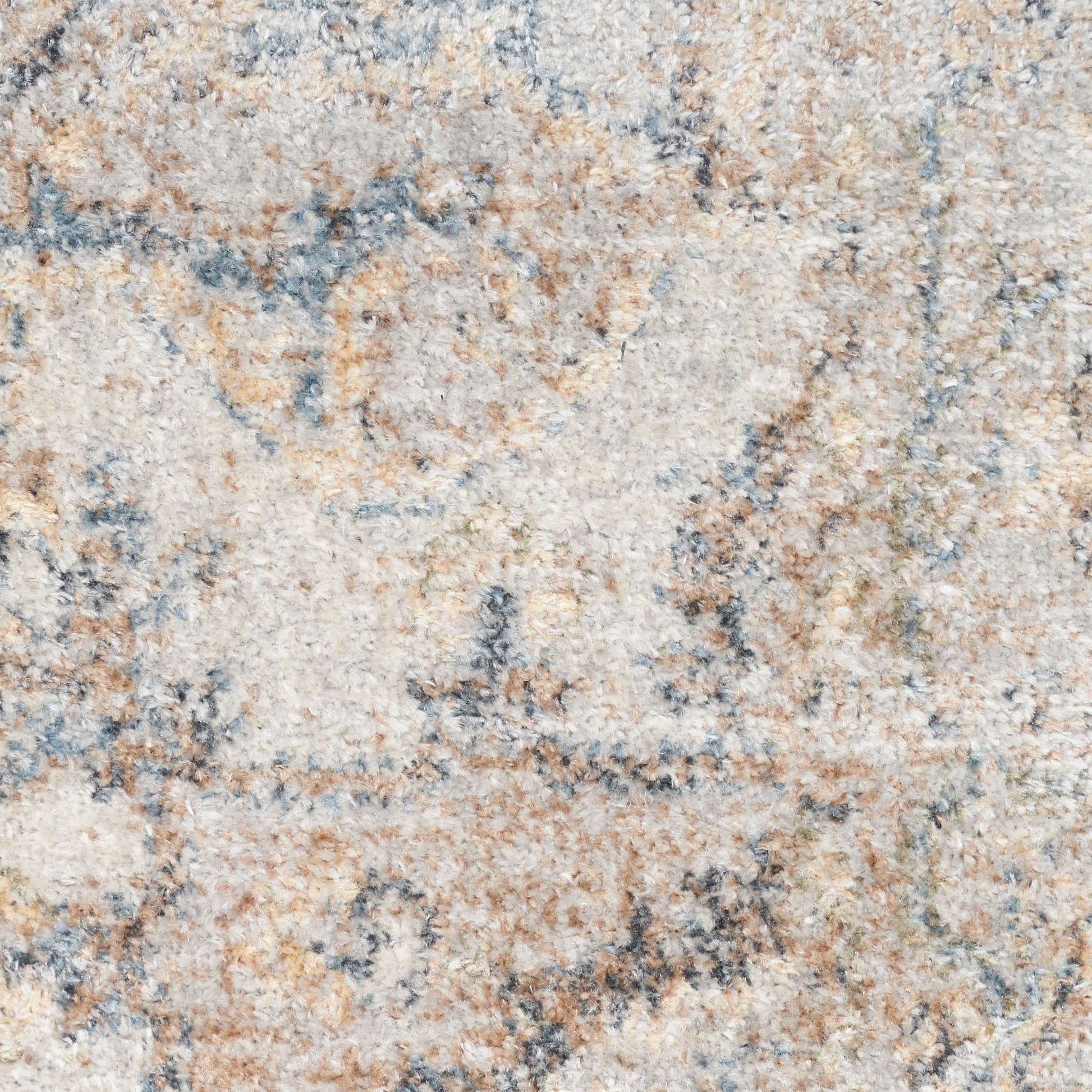 Close-up of an ivory-beige Persian-style area rug with blue and tan floral motifs; soft, textured pile.