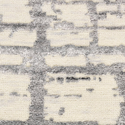 Cream and gray textured rug with a geometric grid pattern in a soft loop pile.