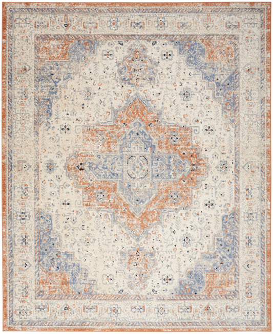 Distressed ivory oriental area rug with blue and rust central geometric medallion and ornate border.