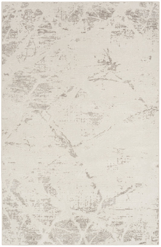 Cream-beige rectangular area rug with a subtle gray distressed damask pattern; soft, low-pile look.