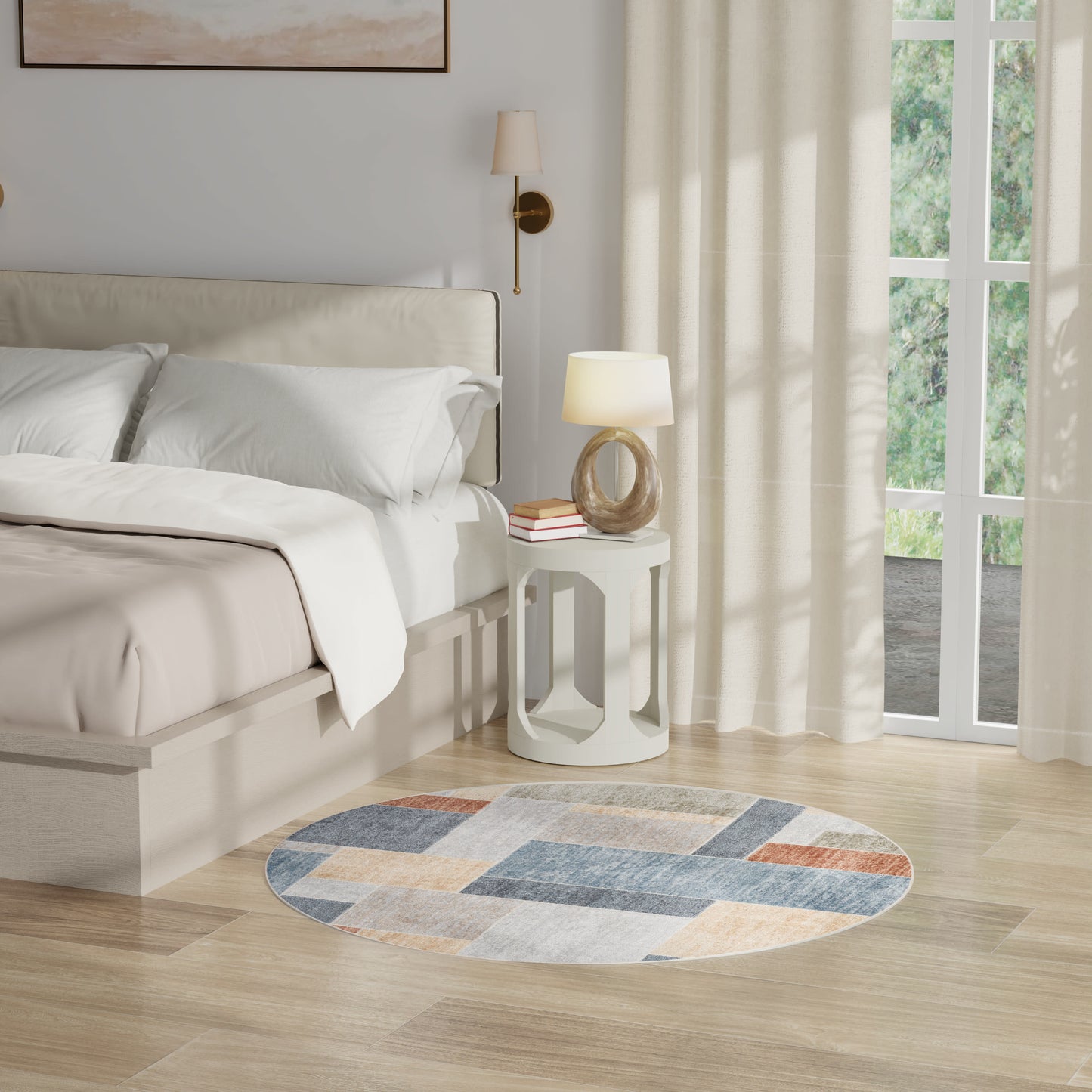 Neutral bedroom with beige bed, white bedding, round geometric rug, white circular side table, lamp & sheer curtains.
