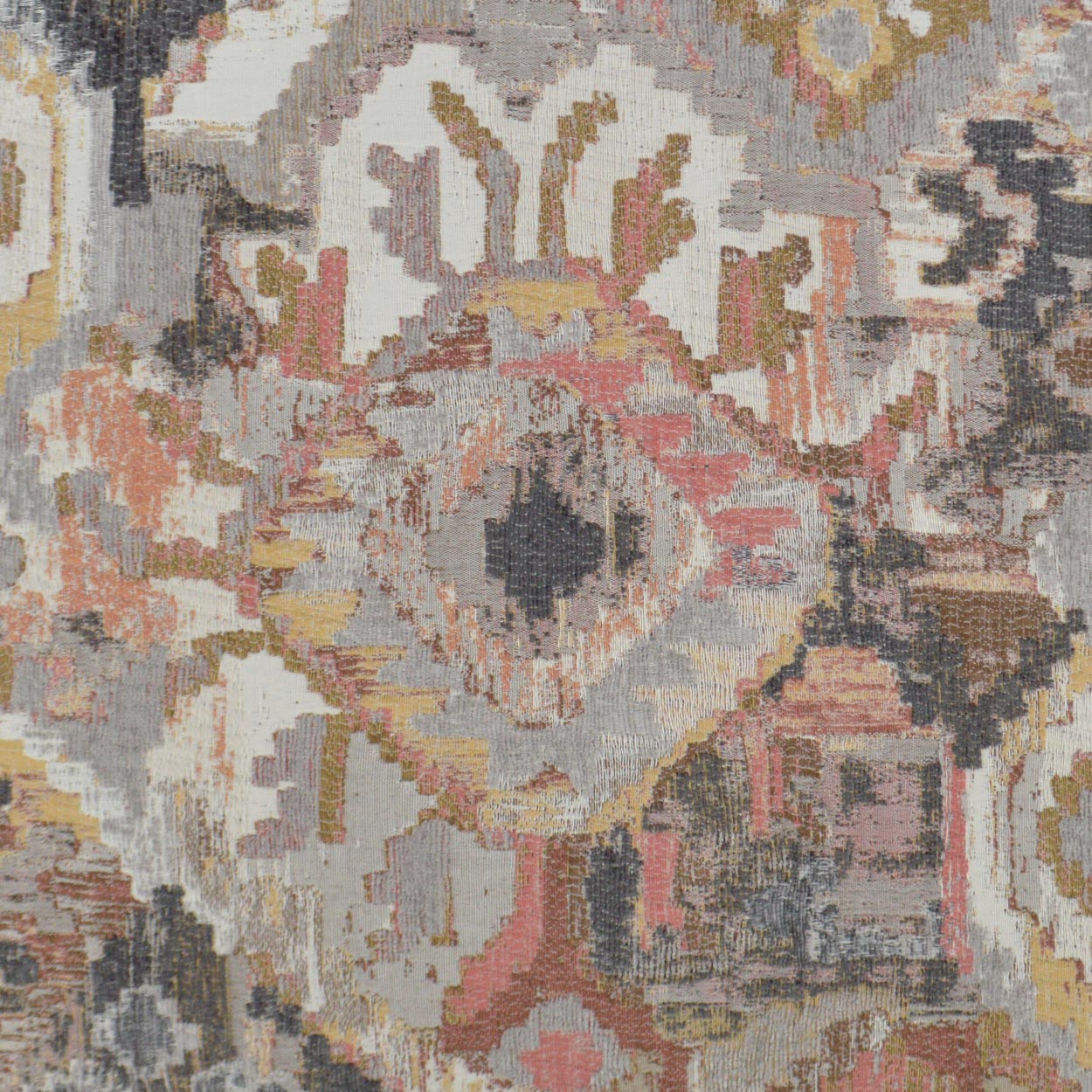 Bohemian woven rug with a distressed medallion motif in ivory, blush pink, gray, gold and charcoal.