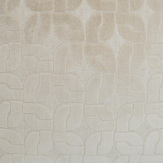 Cream-beige textured fabric with a subtle raised geometric pattern of interlocking curved blocks.