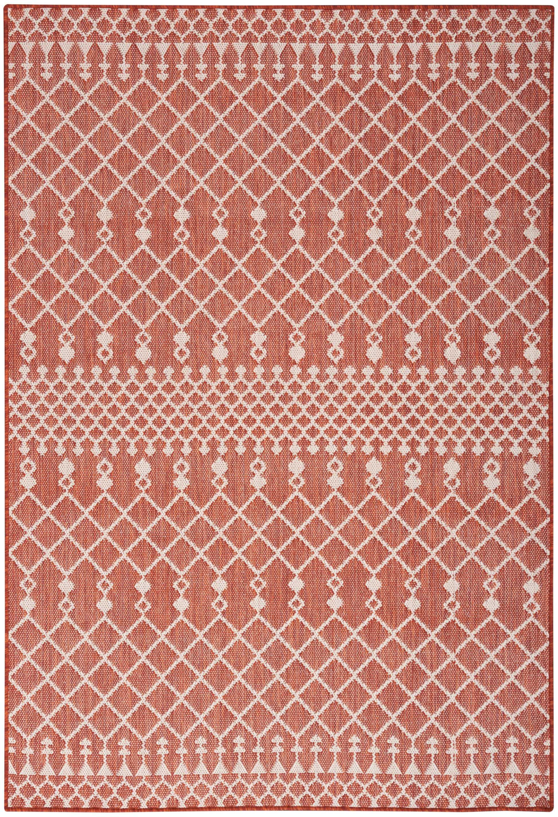 Rectangular terracotta woven rug with white lattice diamond pattern and dotted borders; Bohemian geometric style.