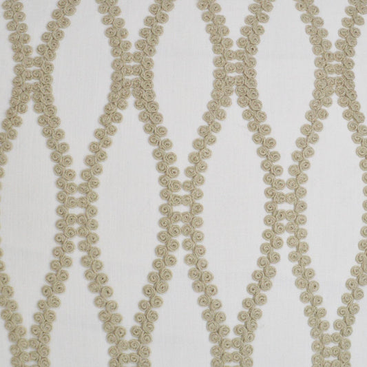 Beige rosette-trim fabric with interlocking diamond lattice pattern; ideal for decor.