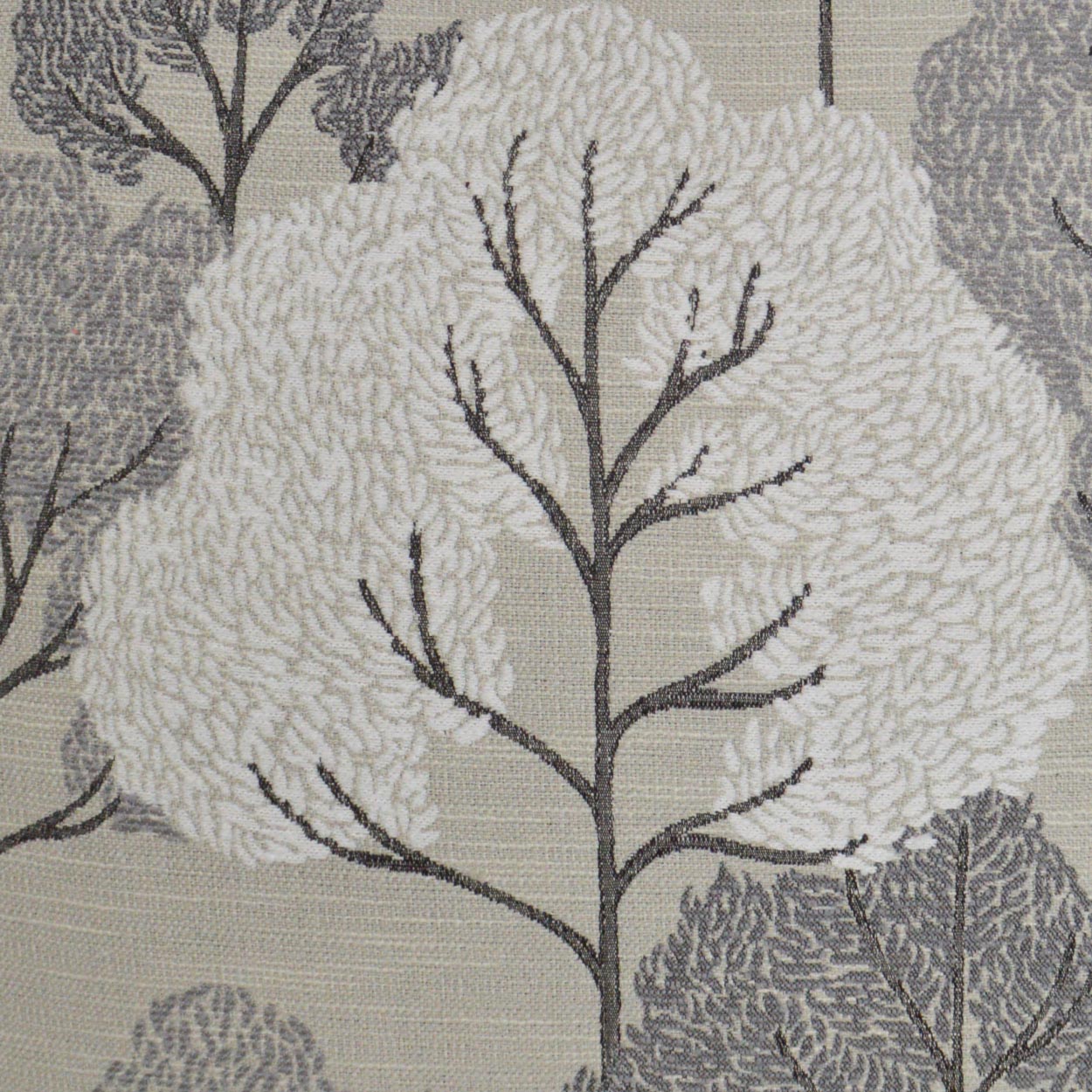 Beige fabric featuring large white tree silhouettes with gray branches in a damask-style botanical pattern.