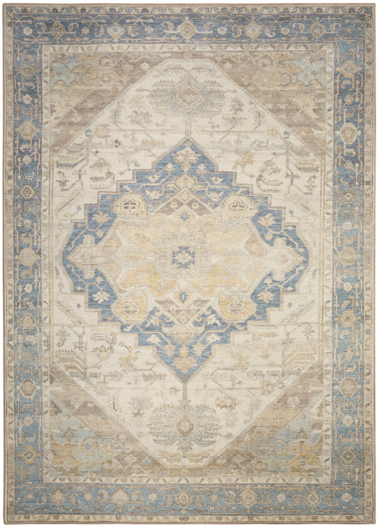 Distressed Persian-inspired rug with ivory field, blue central medallion, and blue floral border.