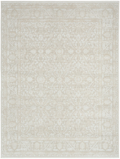 Cream-beige area rug with subtle floral/medallion pattern and decorative border, rectangular.