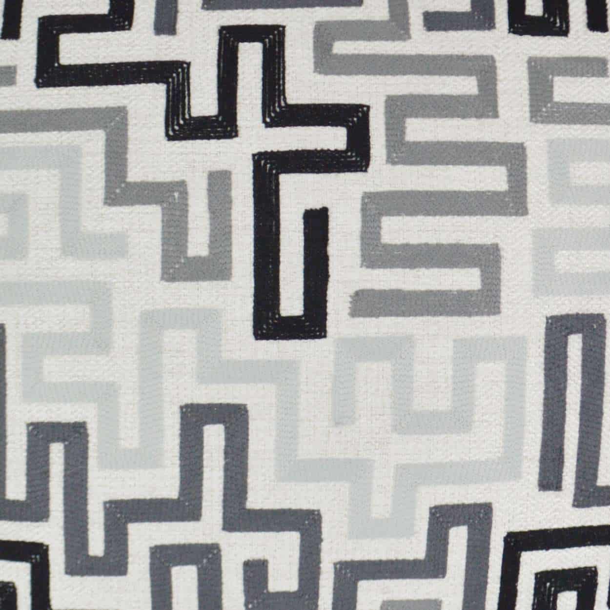 Maze-like geometric print on white fabric in black and gray.