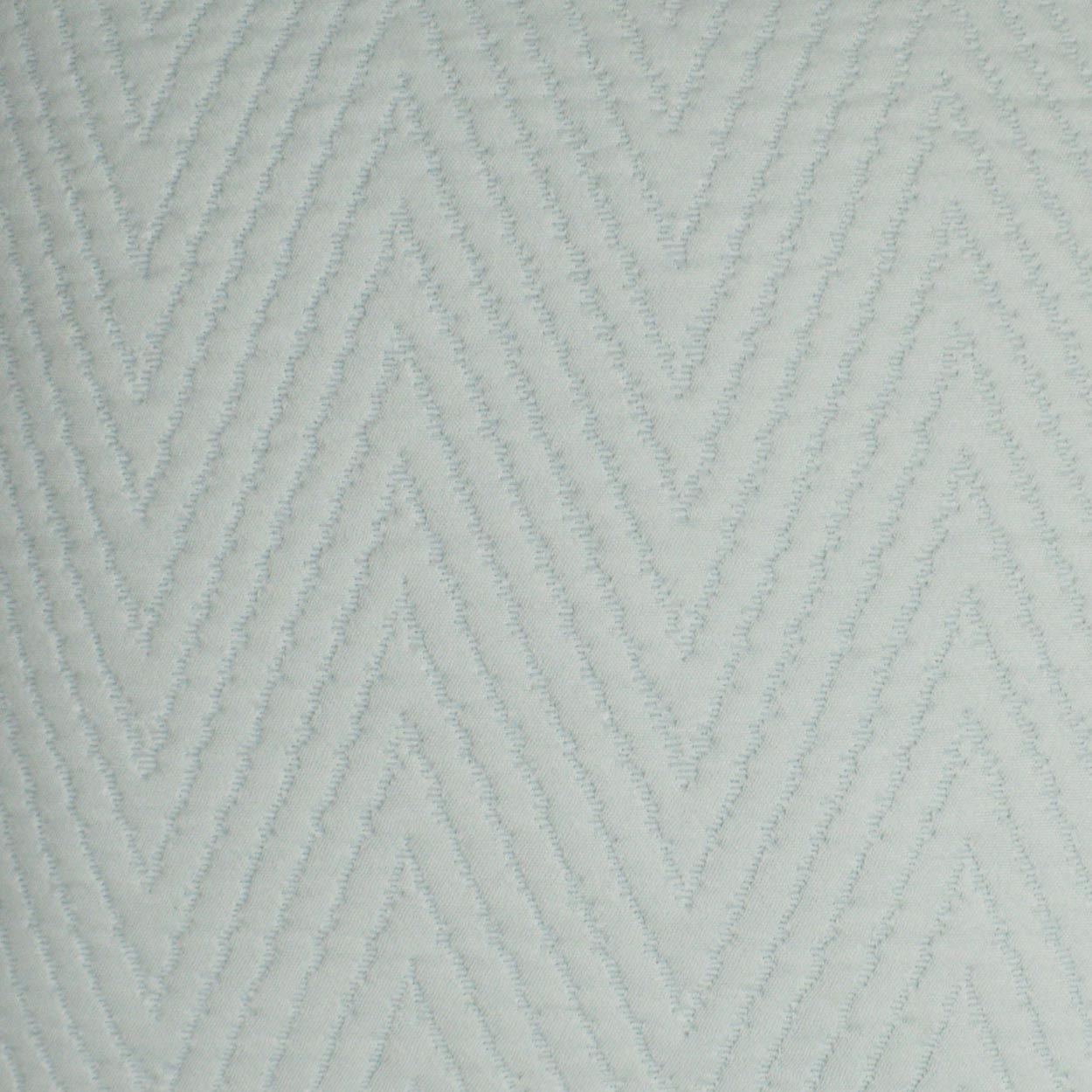 Light blue-gray fabric with raised chevron zigzag pattern and soft textured ridges.