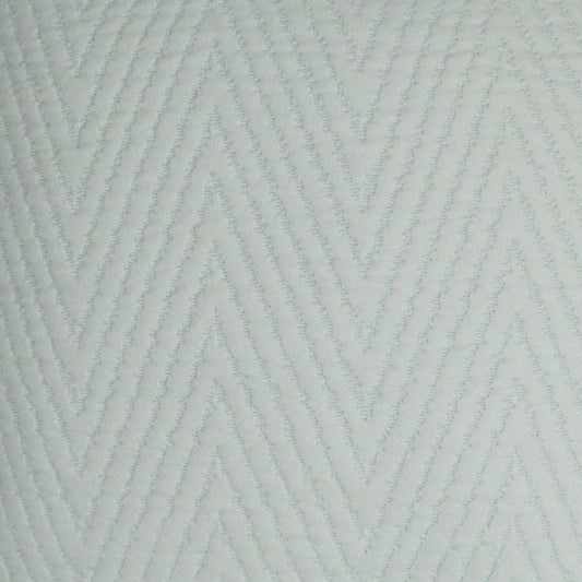 Light blue-gray fabric with raised chevron zigzag pattern and soft textured ridges.