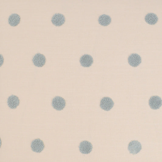 Cream fabric with evenly spaced pale blue polka dots, soft textile pattern for clothing or home decor.