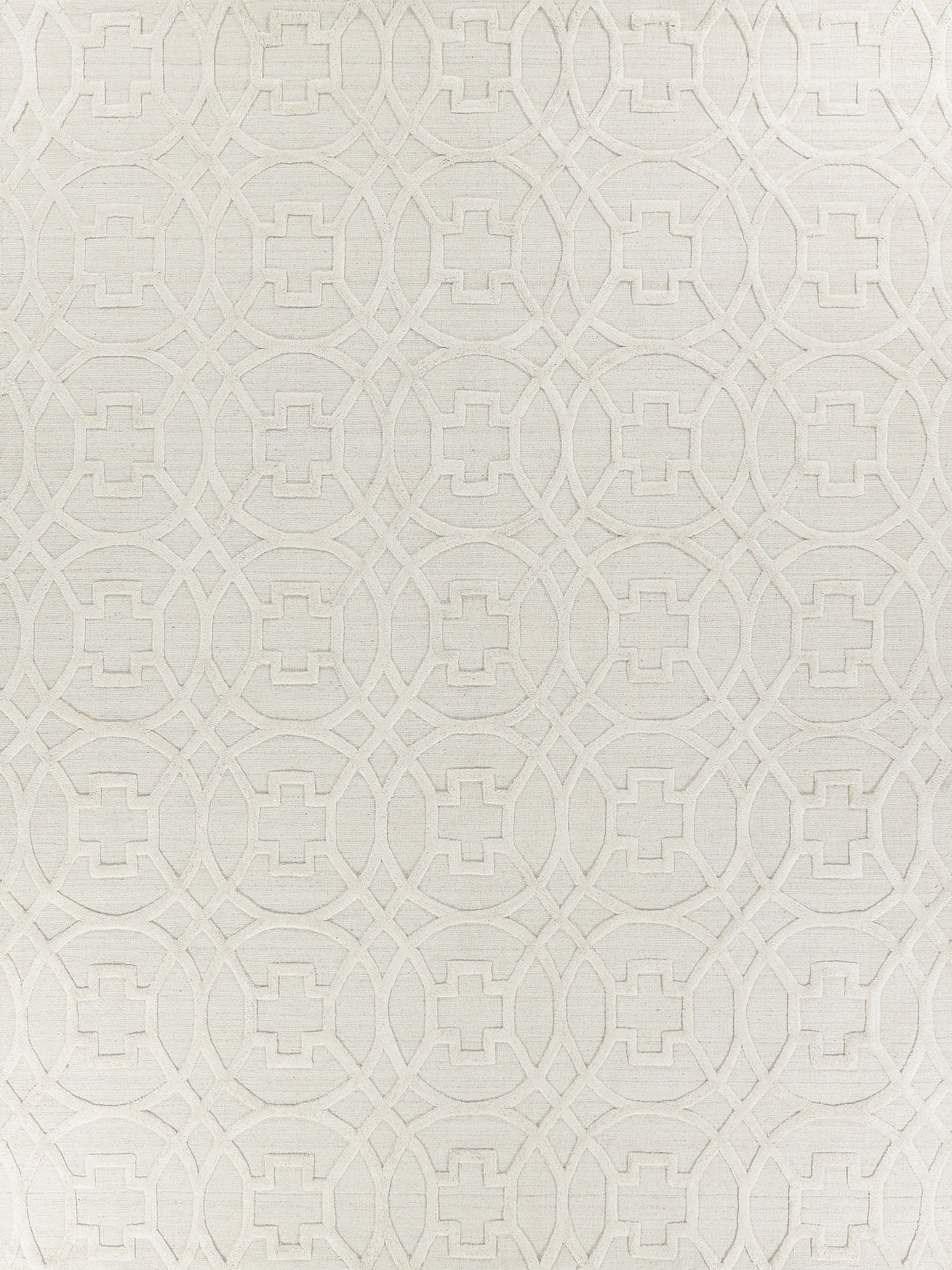 Cream textured rug with repeating interlocking circles and square motifs; subtle embossed geometric pattern; indoor hand loomed rug.