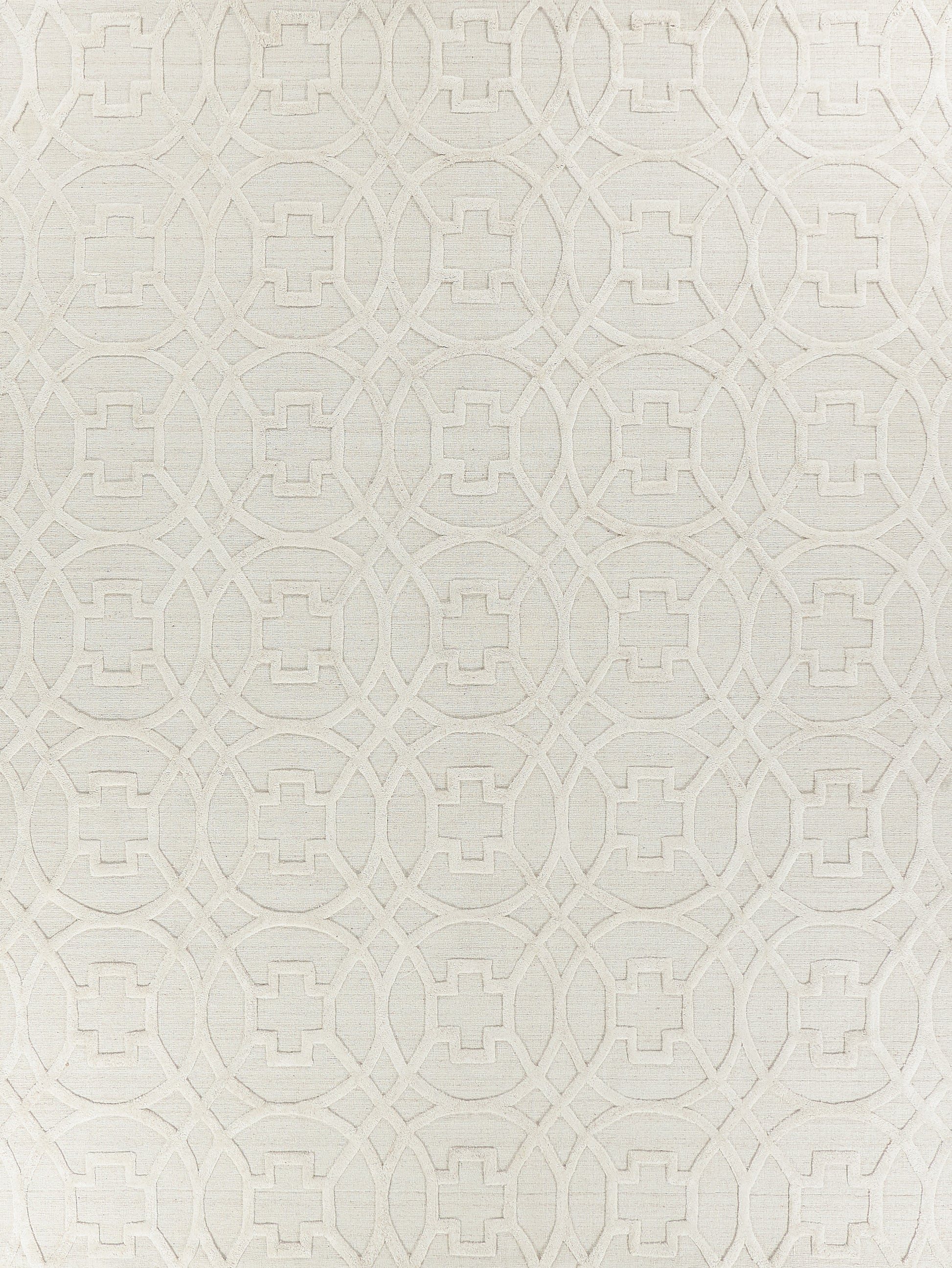 Cream-beige textured rug with an embossed geometric pattern of interlocking circles and central squares.