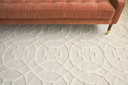 Cream geometric rug with interlocking circle pattern.