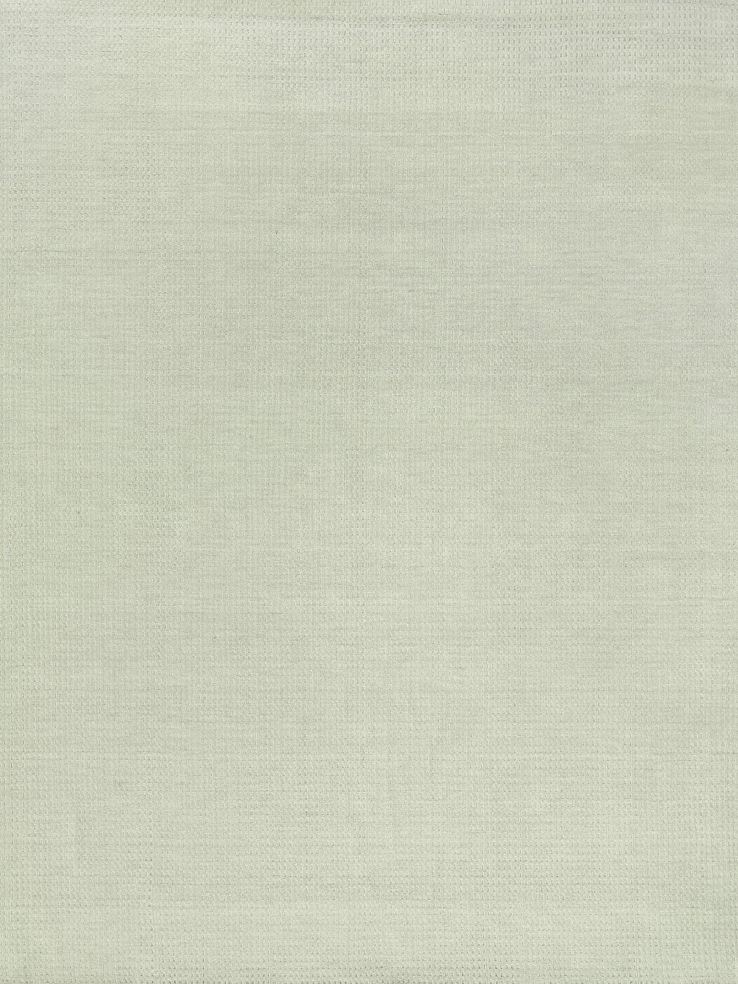 Beige New Zealand wool rug with a subtle hand-loomed weave; indoor use, 6' x 9'.