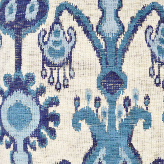 Ivory damask fabric with ornate blue and teal floral motifs; woven textile with vintage elegance.