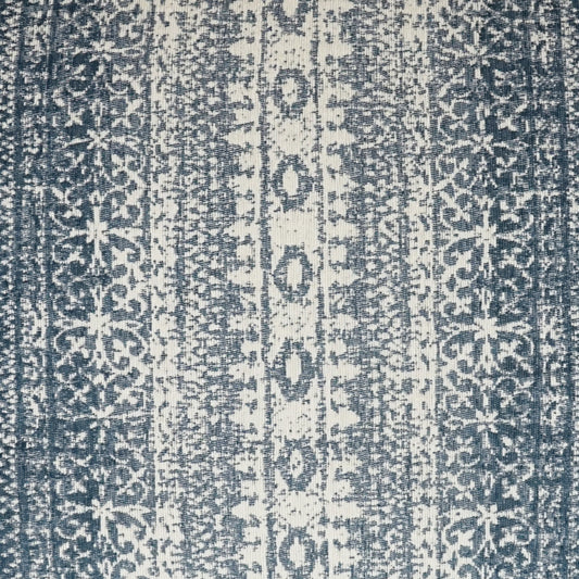 Blue and ivory striped textile rug with vertical geometric medallion motifs; woven floor decor.