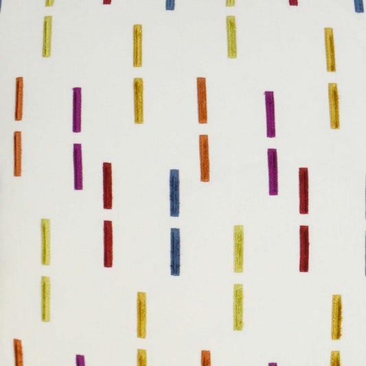 White fabric with randomly spaced vertical color dashes in yellow, orange, red, purple and blue.