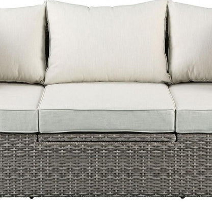 Three Piece Outdoor Gray Wicker Sectional Seating Group with Beige Cushions