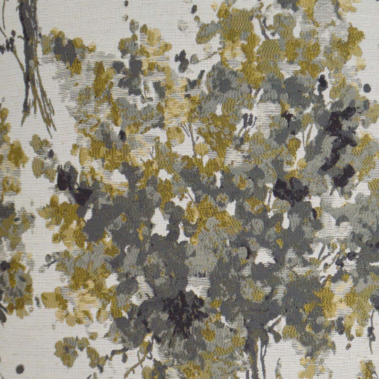 Pillow with abstract floral pattern featuring mustard yellow, gray and black blossoms on beige.