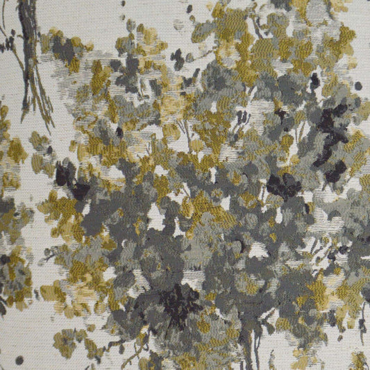 Abstract floral fabric pattern with yellow, gray, and black brushstrokes on a light background.