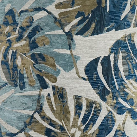 Botanical leaf print fabric in blues, teals, and taupe on light heather gray; woven textile for upholstery or drapes.