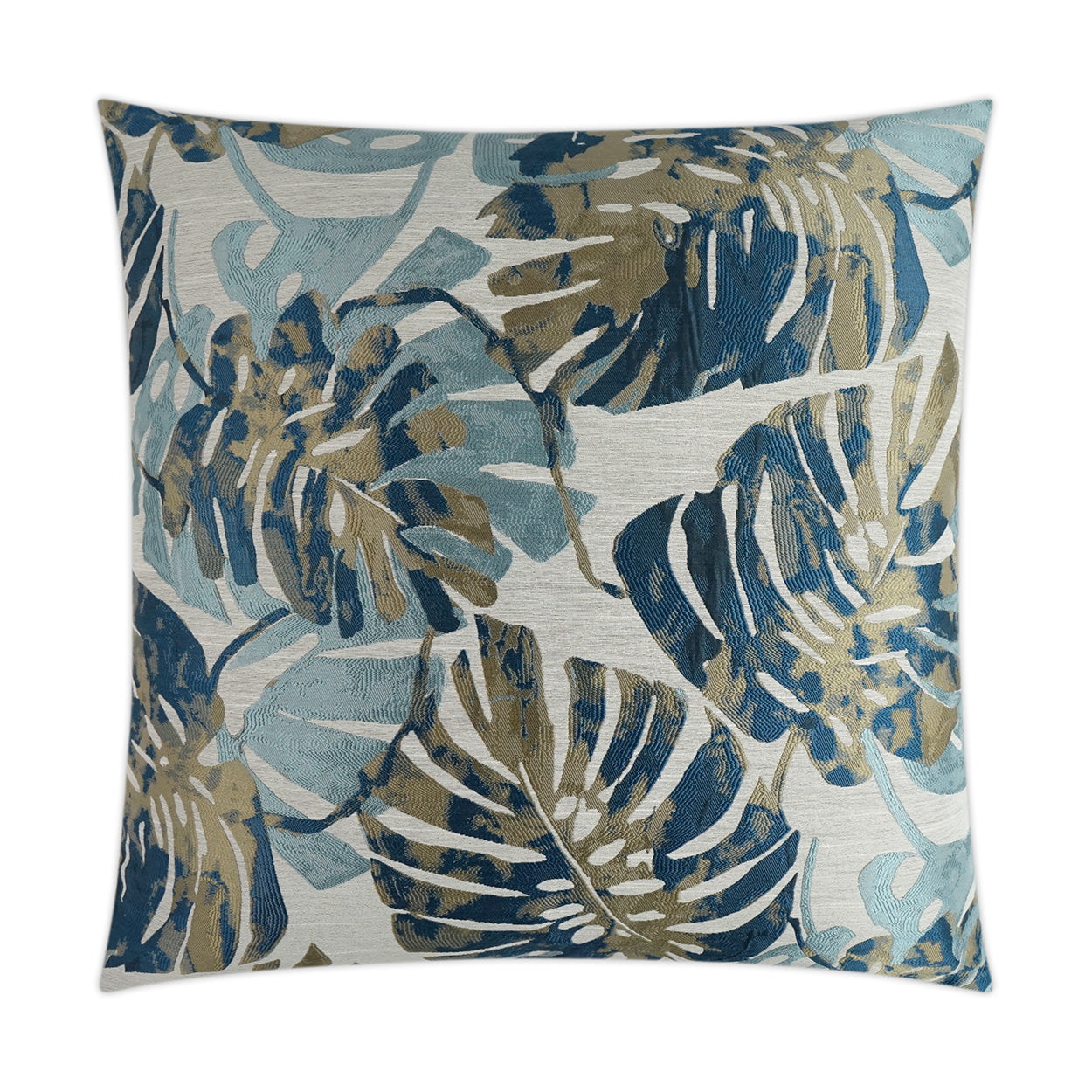 Square decorative pillow with blue, teal and olive monstera leaf pattern on light gray woven fabric.
