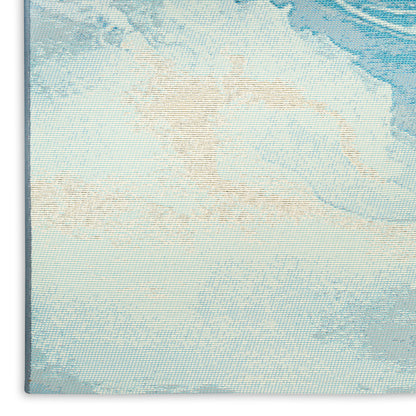 Close-up of light blue woven tapestry with beige design; textured coastal abstract wall decor.