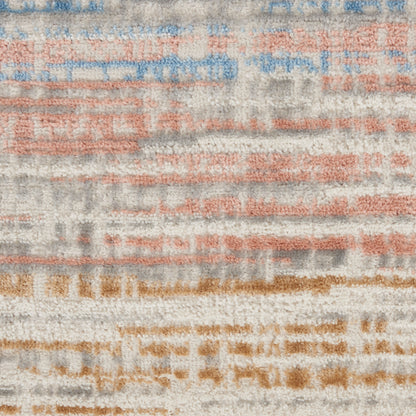 Abstract striped area rug with cream base & blue, peach & tan brushstroke bands.