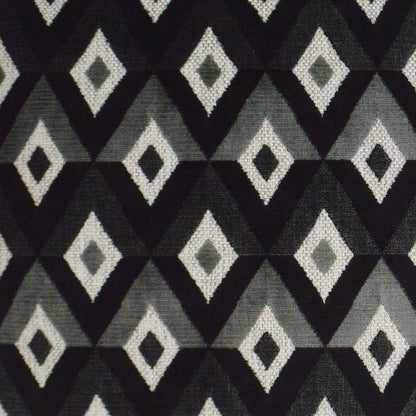 Pillow with geometric diamond-pattern in black, charcoal, light gray and white; 24" x 24