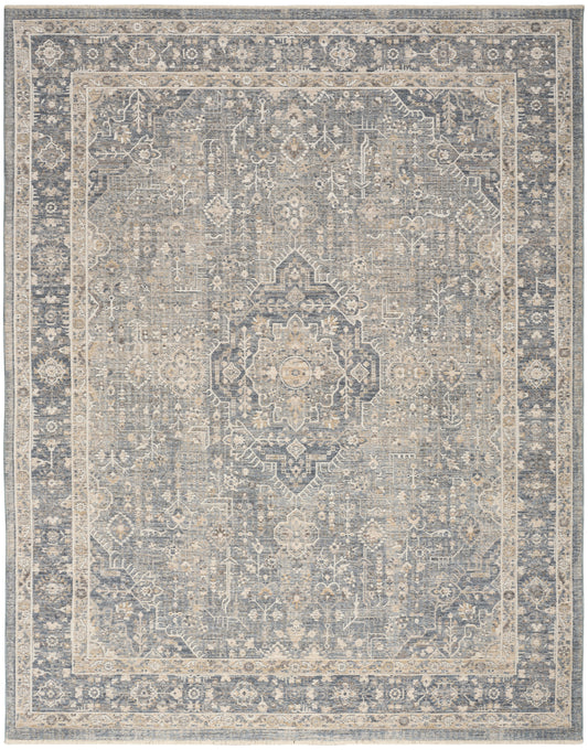 Muted blue and beige oriental area rug with central medallion and ornate border, vintage distressed finish.