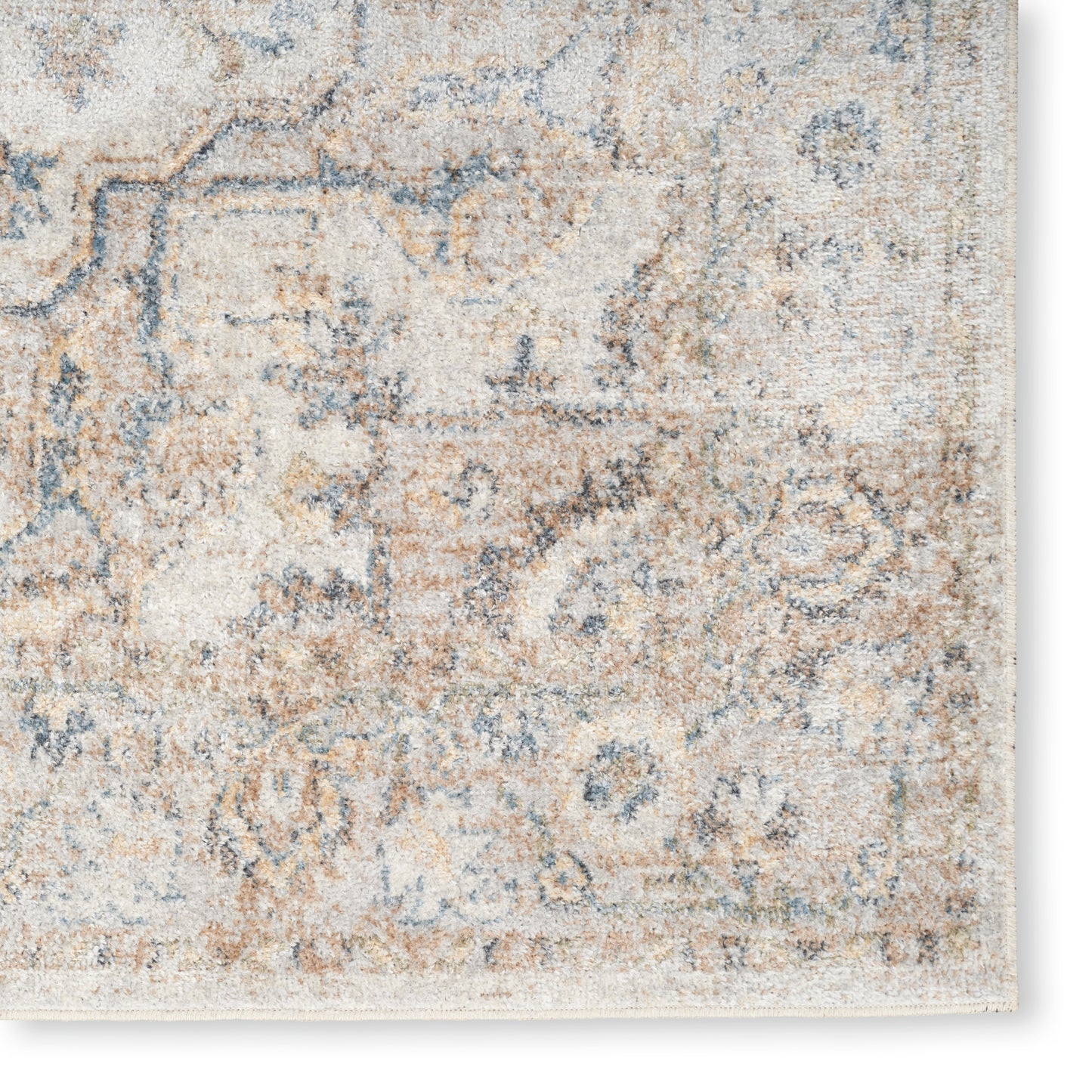 Distressed cream and pale blue oriental-style area rug with vintage beige tones and faded floral motifs.