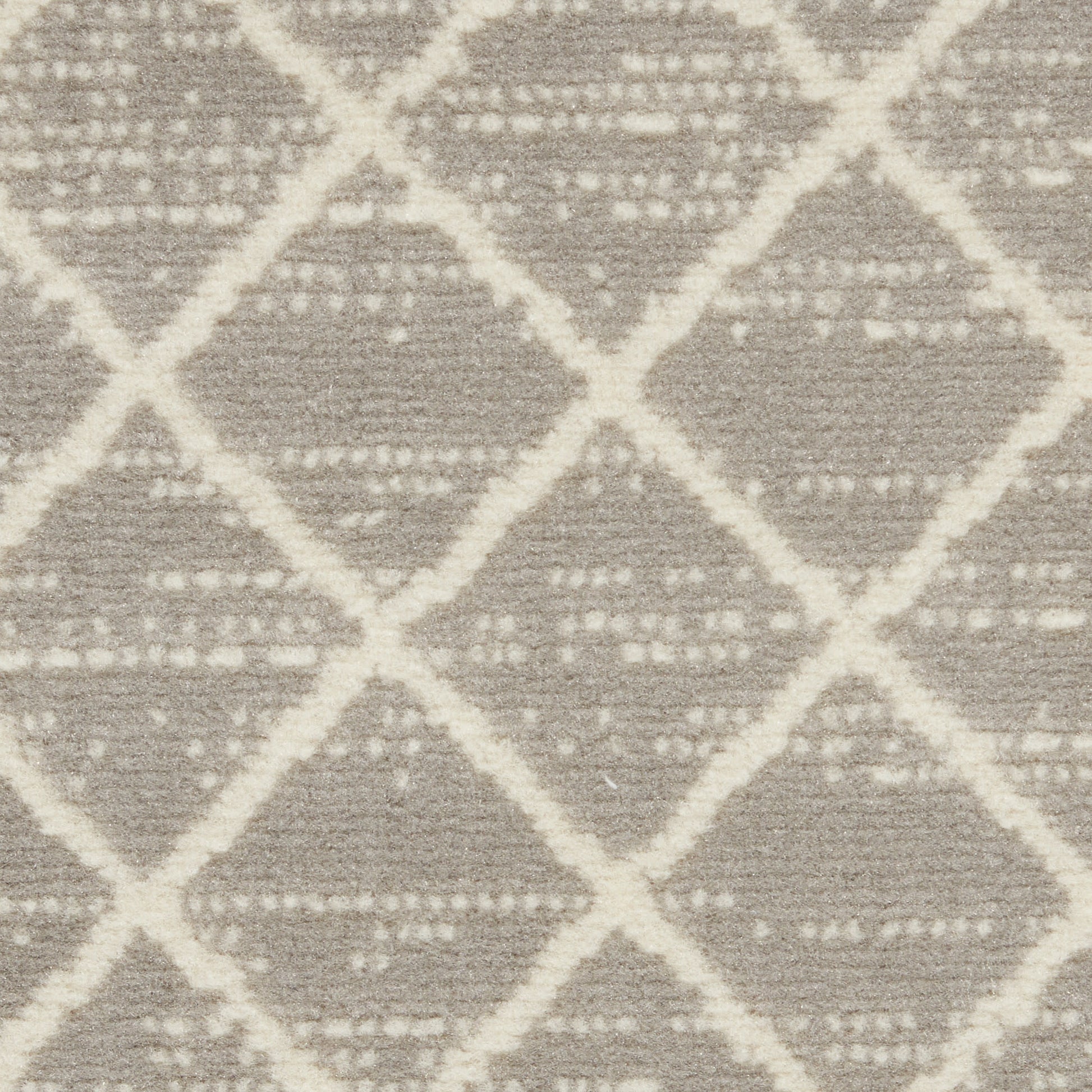Woven rug with pale cream diamond lattice on gray-beige background.