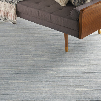 Modern blue striped rug in neutral gray tones, 8' x 10'.
