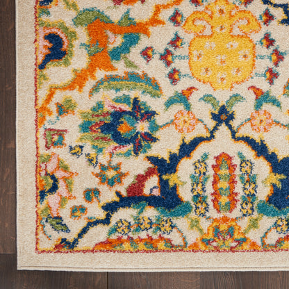 Colorful oriental rug with beige background, vibrant blue, orange and yellow floral motifs, border, laid on dark wood floor.