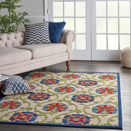 6' x 9' contemporary rug with red-blue floral medallions, green vines, and a navy border