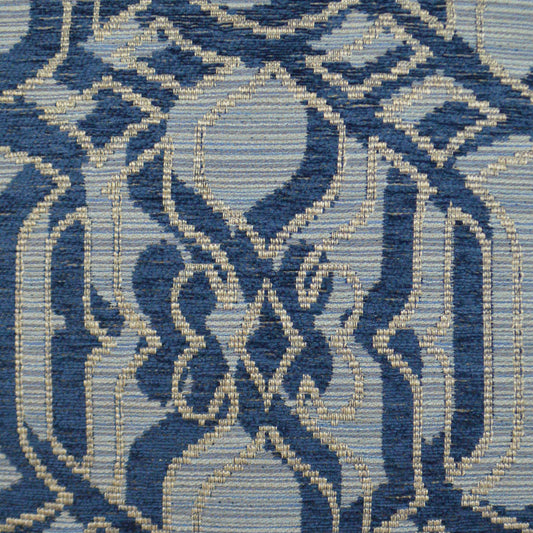 Blue and ivory woven fabric with damask-style geometric medallion pattern.