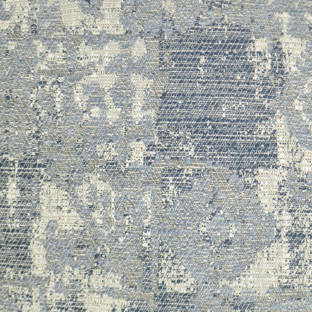 Blue and beige woven fabric with an abstract, snakeskin-inspired marbled pattern for upholstery.