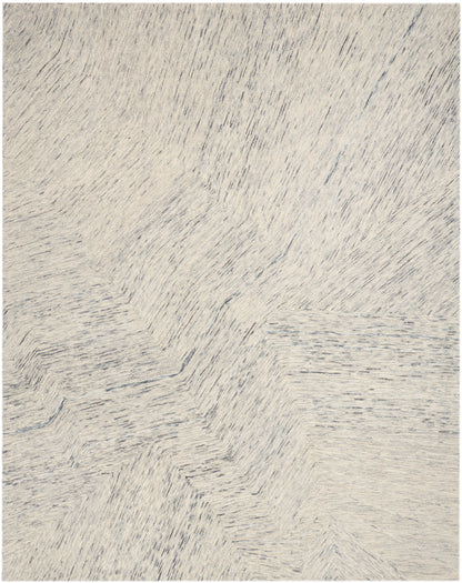 Cream shag rug with soft, subtly variegated gray fibers in a plush, textured pile for cozy living spaces.