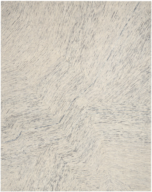 Cream shag rug with soft, subtly variegated gray fibers in a plush, textured pile for cozy living spaces.