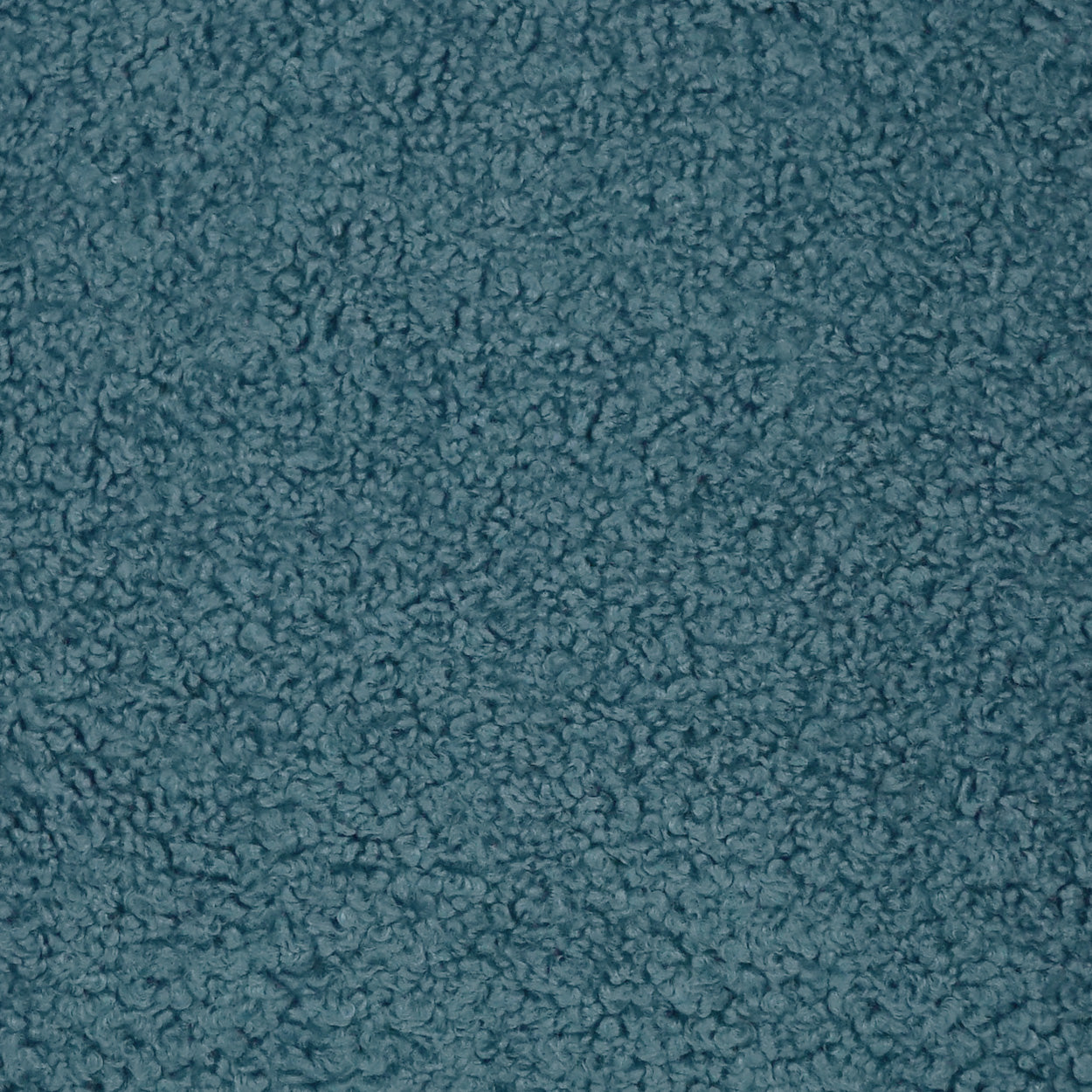 Teal textured fabric close-up with soft fuzzy loops, plush material suitable for upholstery or blankets.