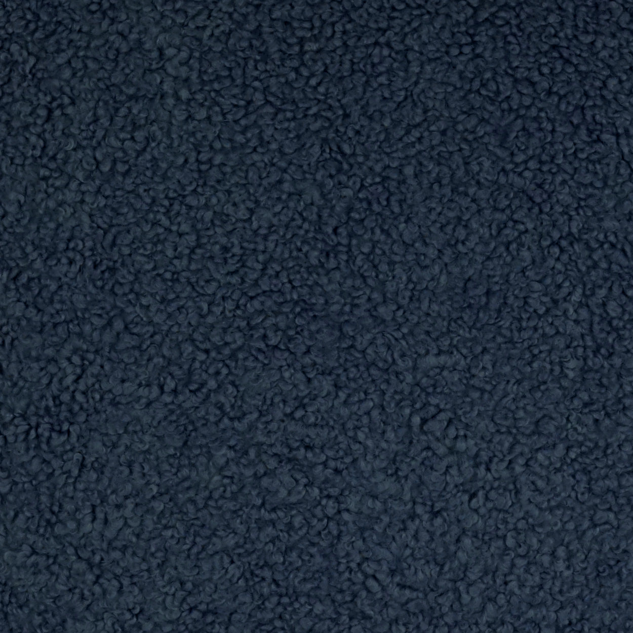 Dark navy boucle fabric close-up with a fuzzy, nubby texture for cozy garments or blankets