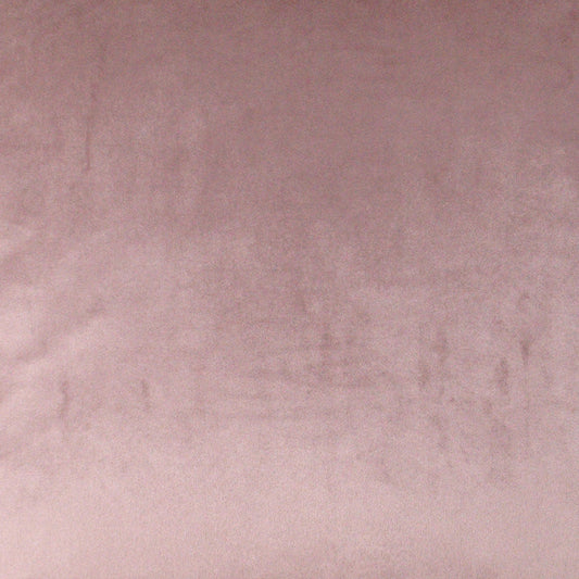 Dusty pink velvet fabric texture with soft, plush surface.