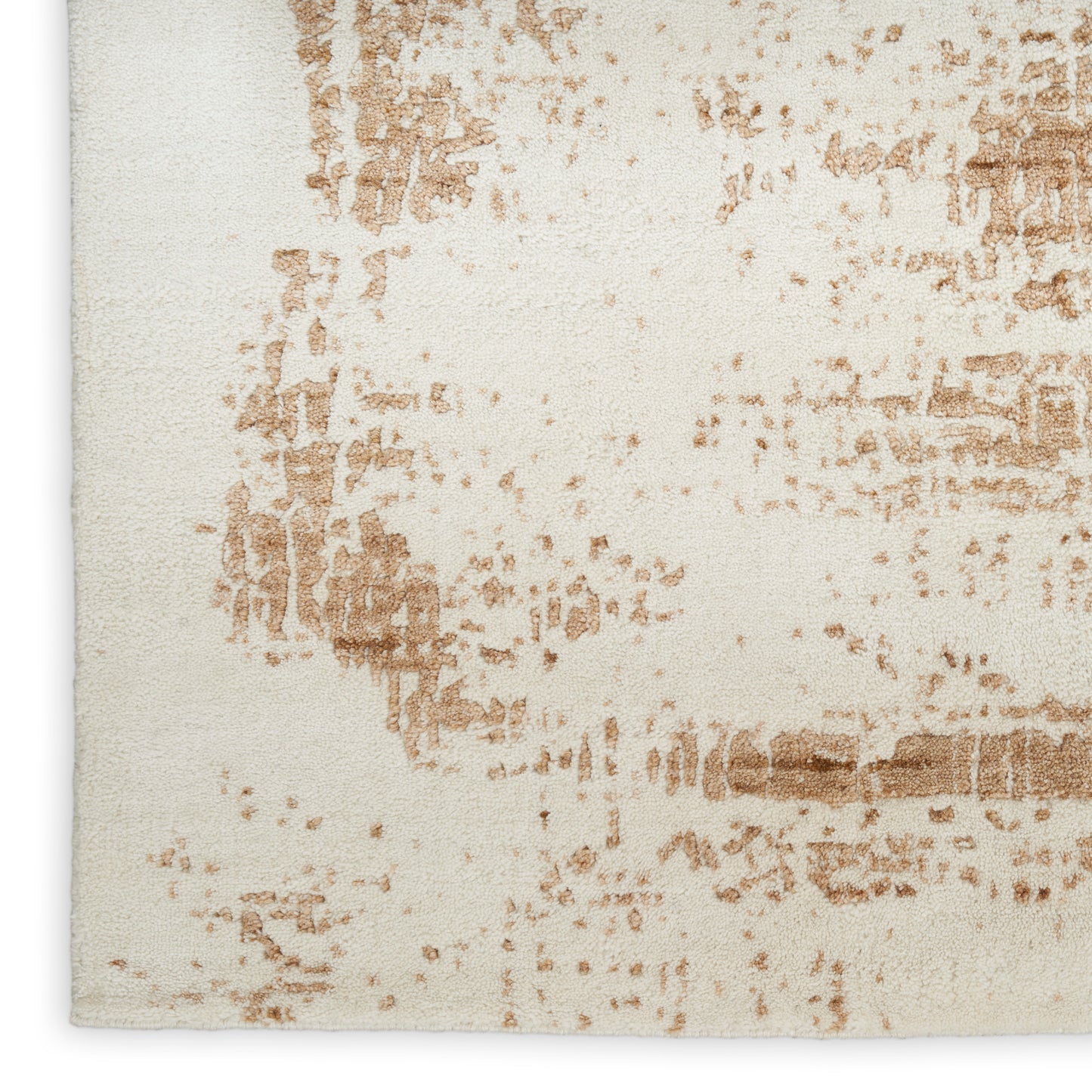 Beige area rug with abstract tan-brown distressed pattern and plush woven texture, modern rustic style.