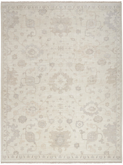 Rectangular cream-beige oriental rug with subtle faded floral medallions and a light gray border.