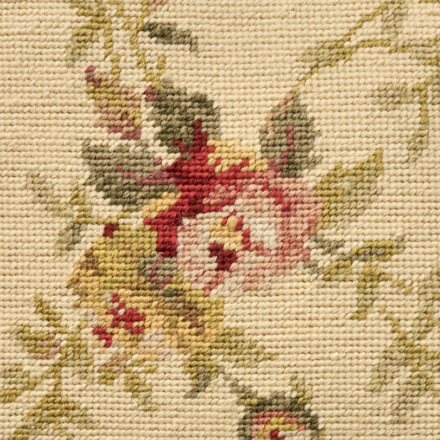 Beige woven tapestry fabric featuring pink roses and green leaves in a floral pattern.