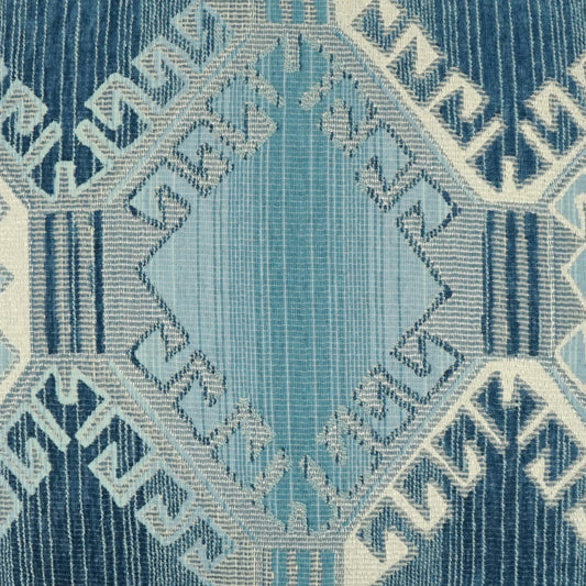 Blue geometric woven rug with a central light-blue diamond medallion and Greek-key border.